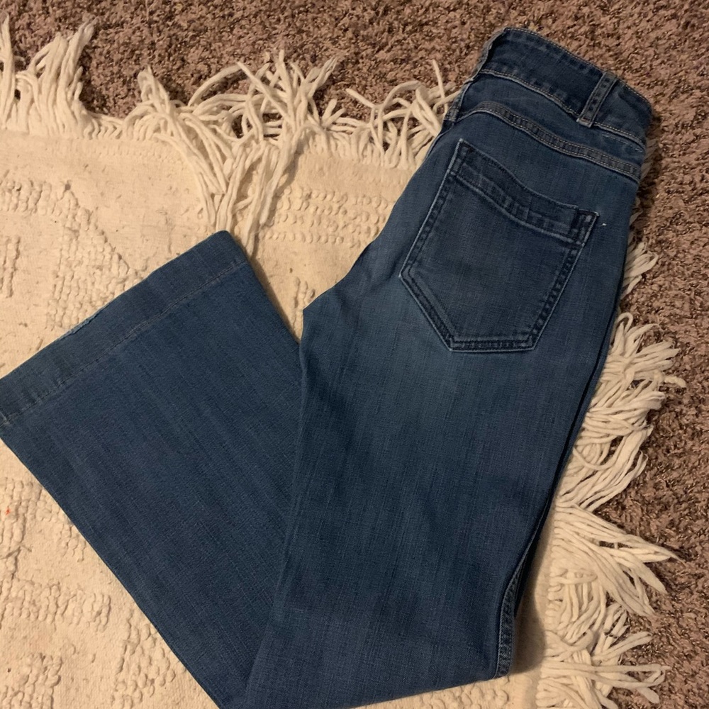 Holding horses bell bottom jeans